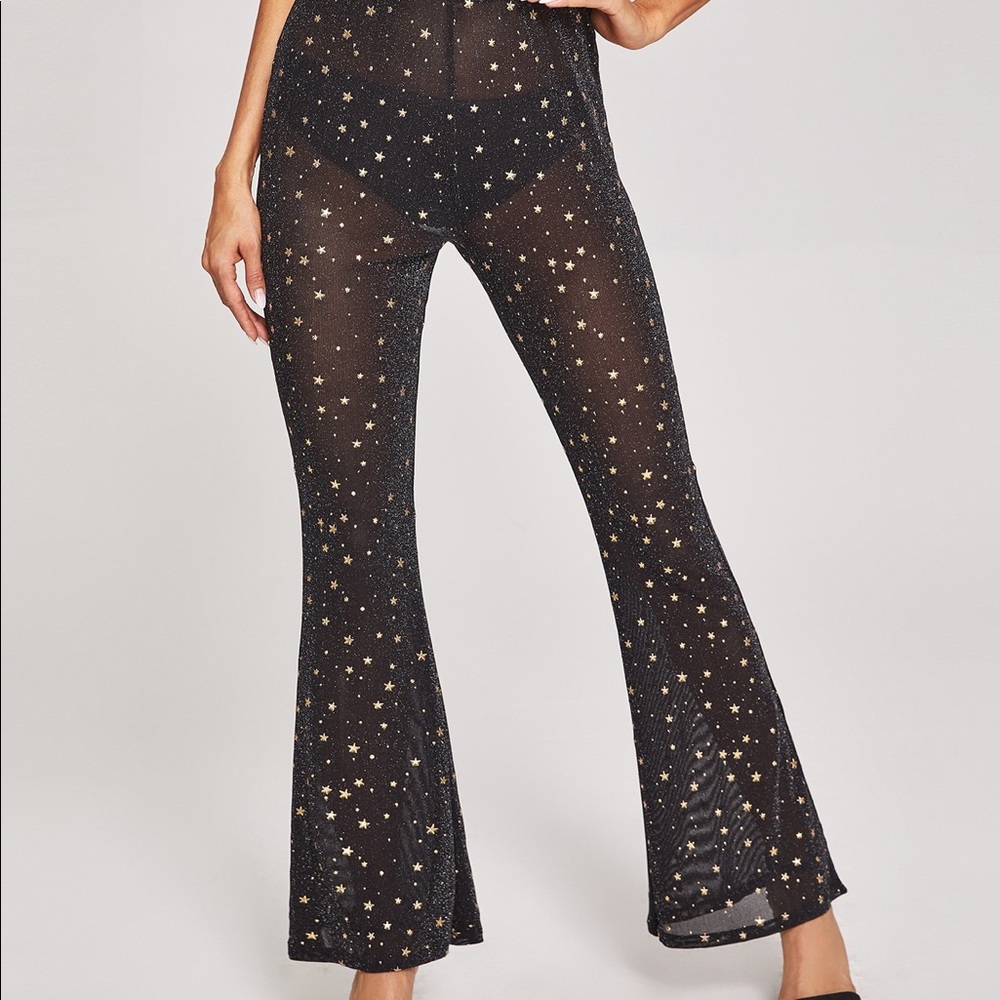 Black sparkly mesh leggings with gold stars